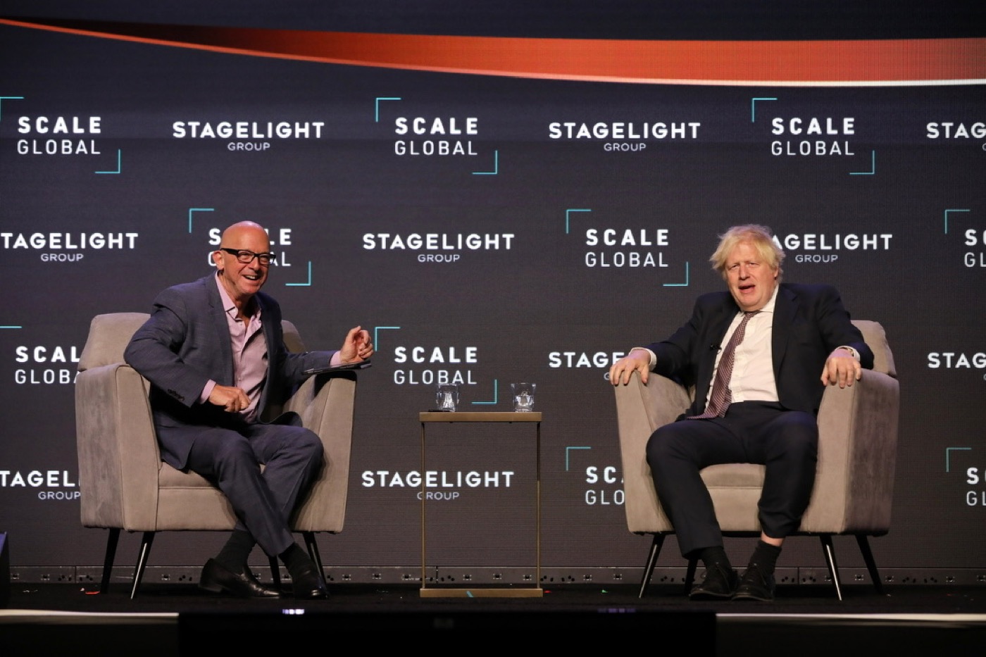 Mark Jeffries laughing with Boris Johnson on stage